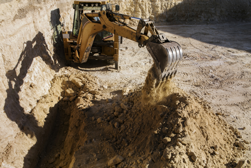 heavy-excavator-digging-day-light-outdoors.jpg